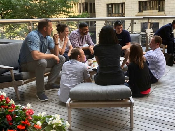[PHOTOGRAPH] A group of corvids enjoying lunch and a story from co-founder Mike Lloyd (far right) in between workshop sessions